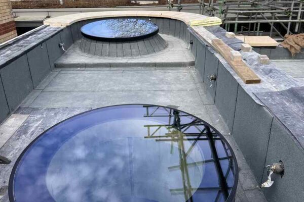 Large round roof light window on a flat roof