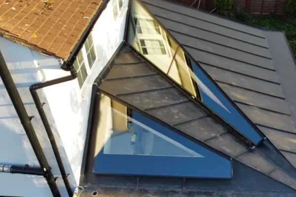 a zinc roof with a skylight